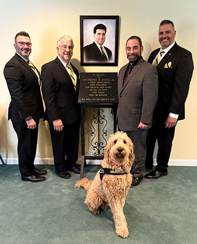 Kevin, Ralph Sr., Ralph Barile Jr. and Philip Cota with Comfort Dog Winnie